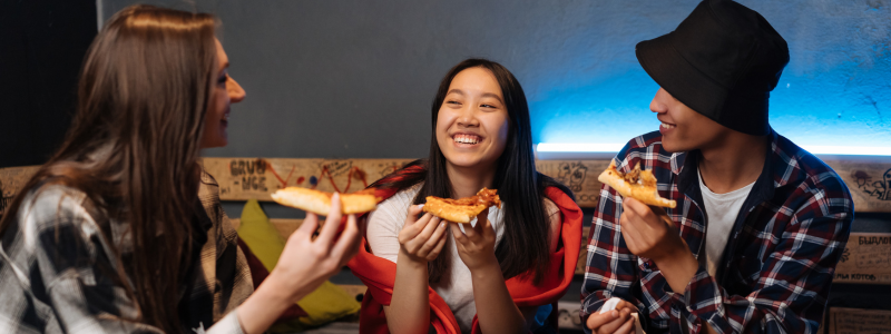 Teens Eating Pizza
