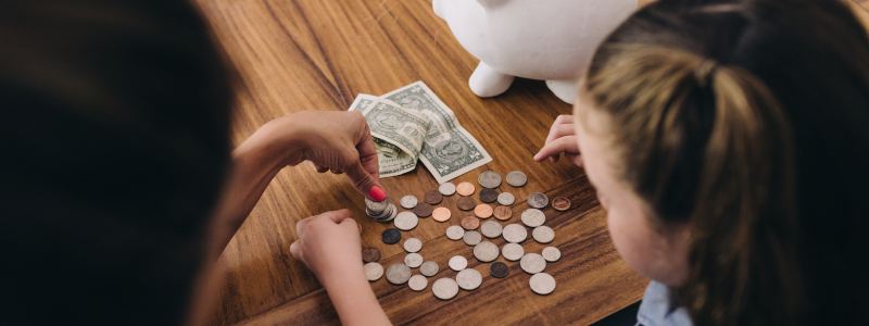 Parent and Kid Counting Money